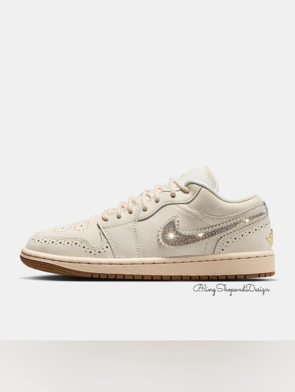 Nike Air Jordan 1 Women’s Low-Top Sneakers in Cream with Gold Sparkle Swoosh